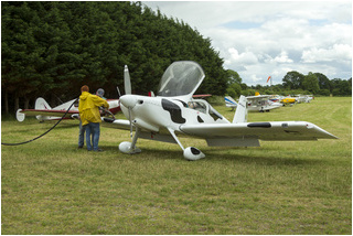 Vans RV-7 EI-HUM being topped up by Harry and Gerry